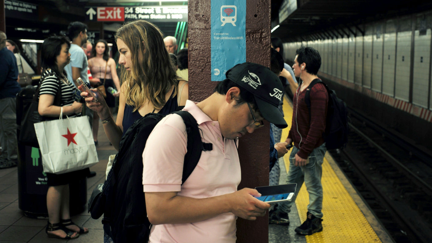 New Yorkers checking their phone&#039;s on the subway