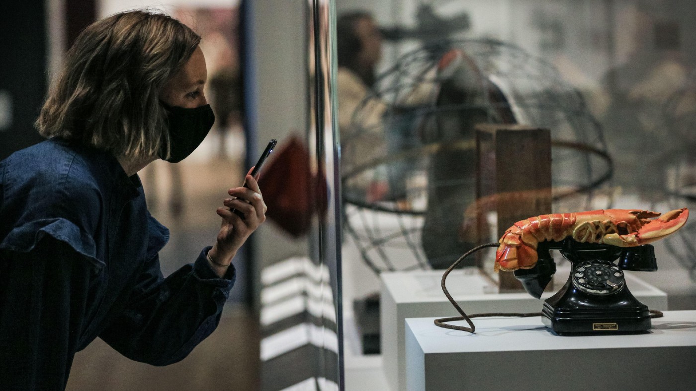 A woman with Salvador Dali’s 1938 Lobster Telephone