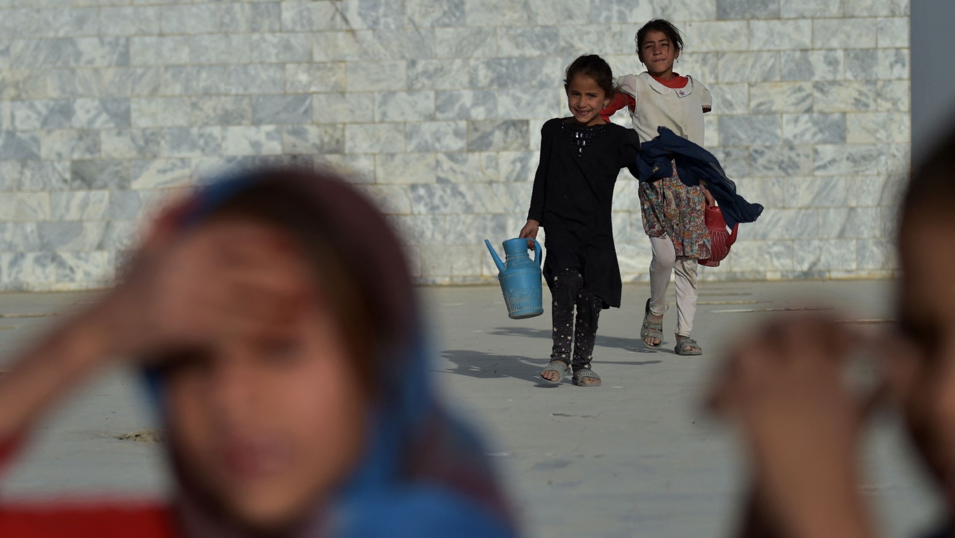 Afghan girls selling water at Nadir Khan hilltop in Kabul   