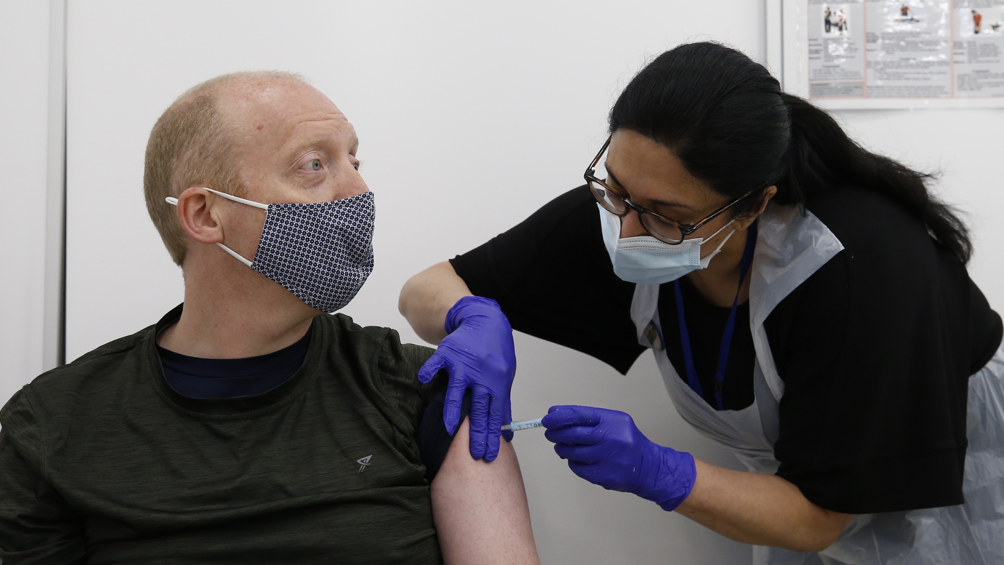 A man receives his Covid-19 vaccination