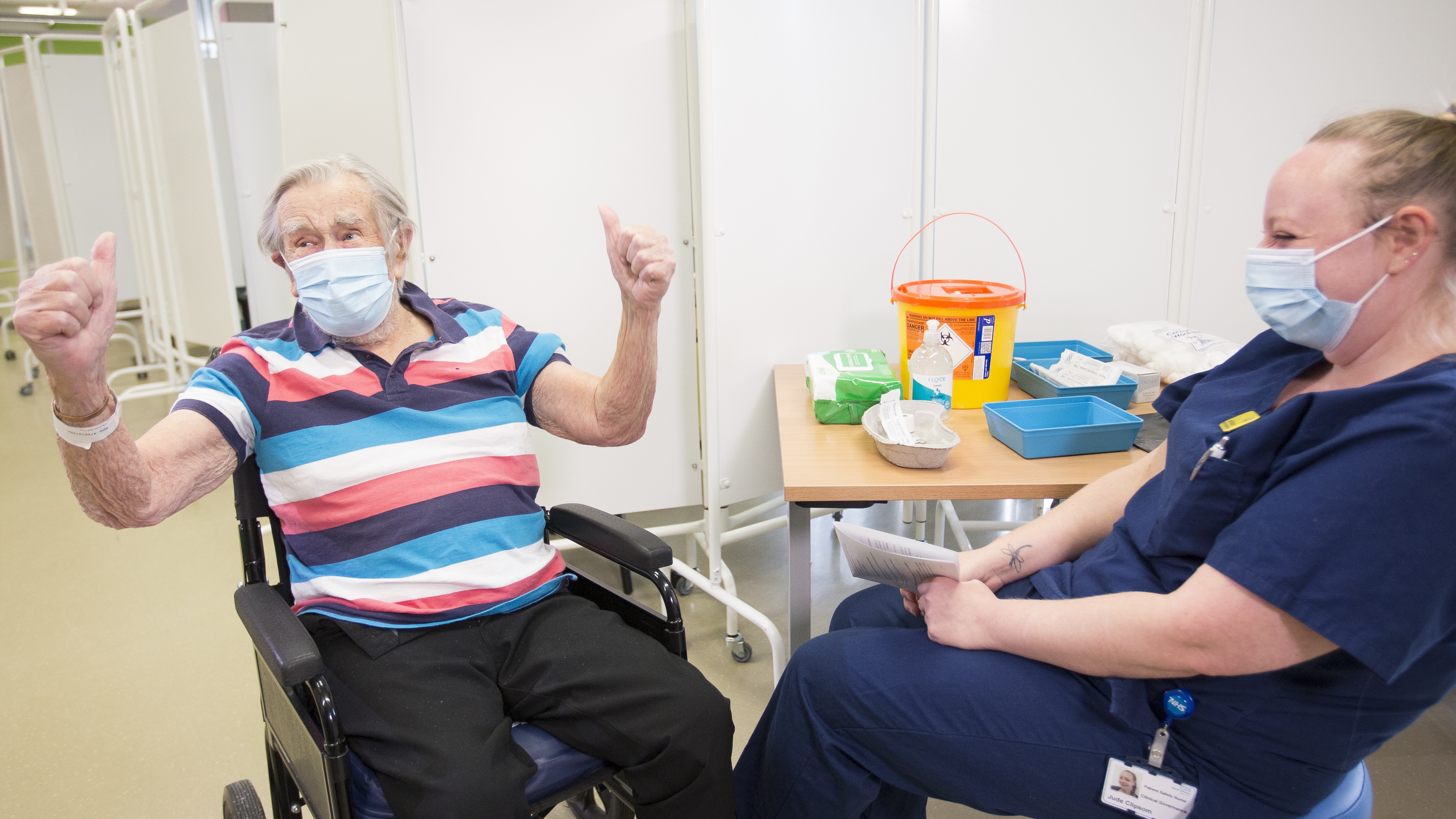 A patient celebrates getting his Covid vaccine at Southmead Hospital in Bristol