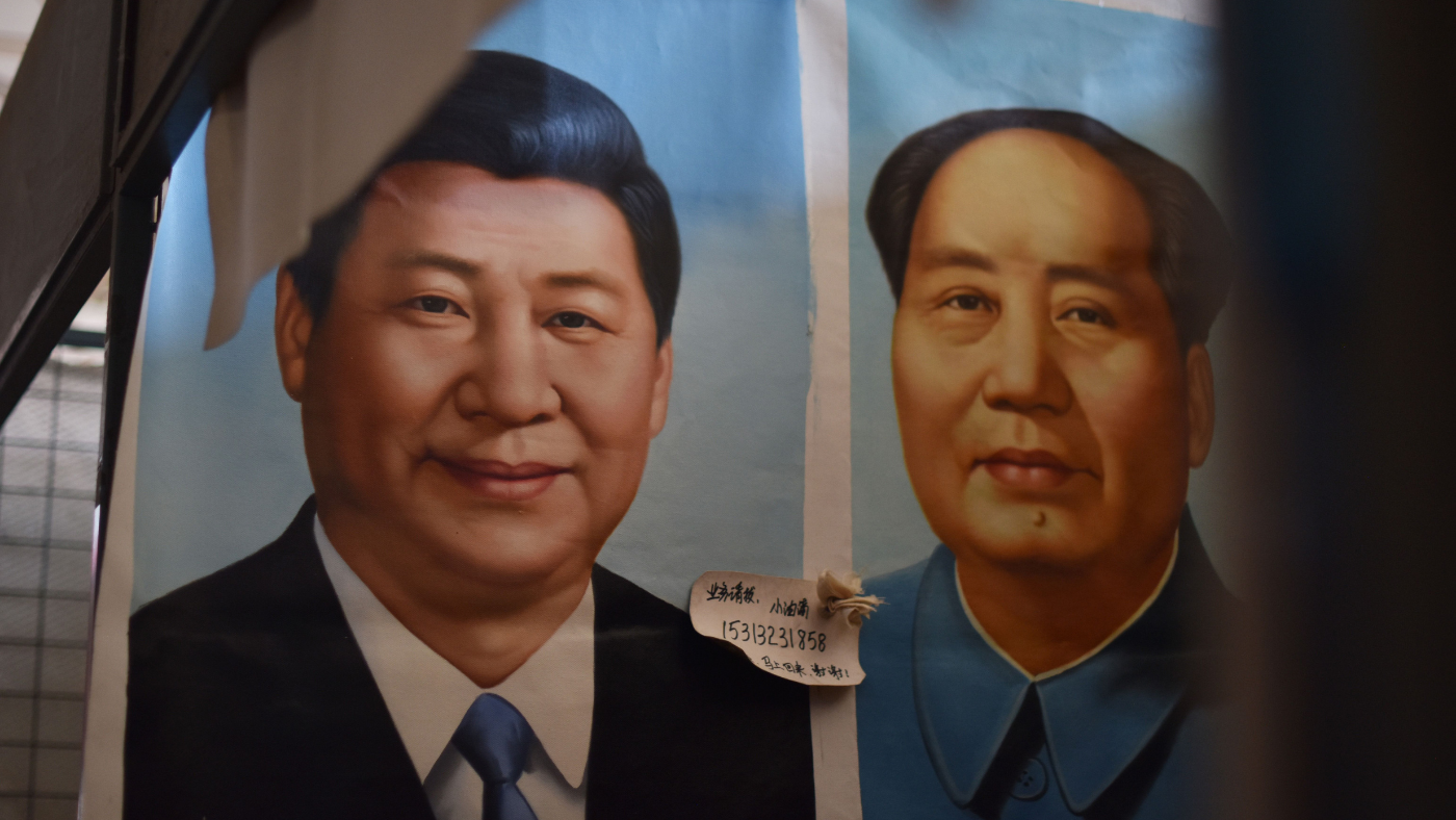 Portraits of President Xi Jinping and the late Mao Zedong