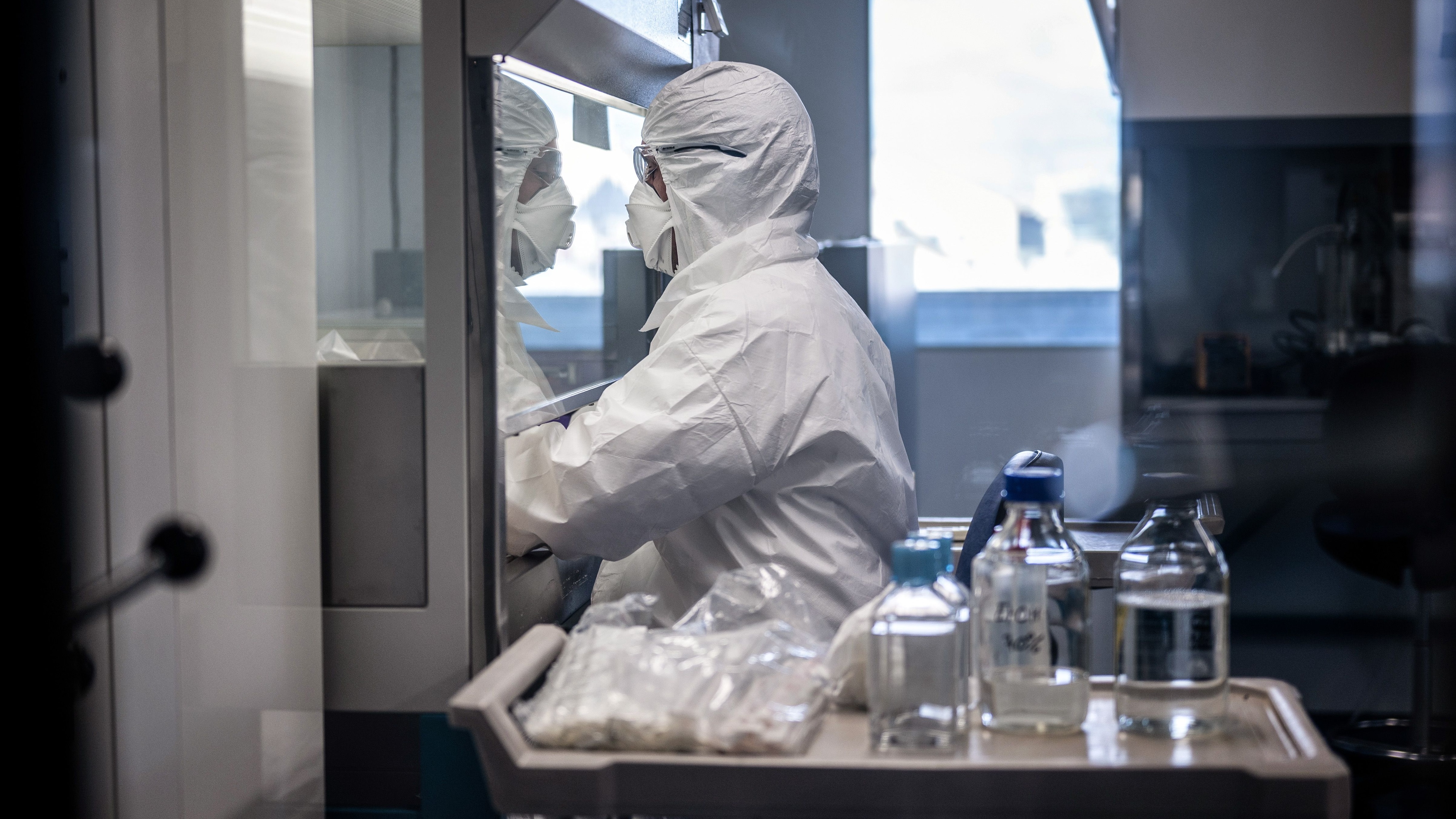 A scientist working on vaccine development in a lab.