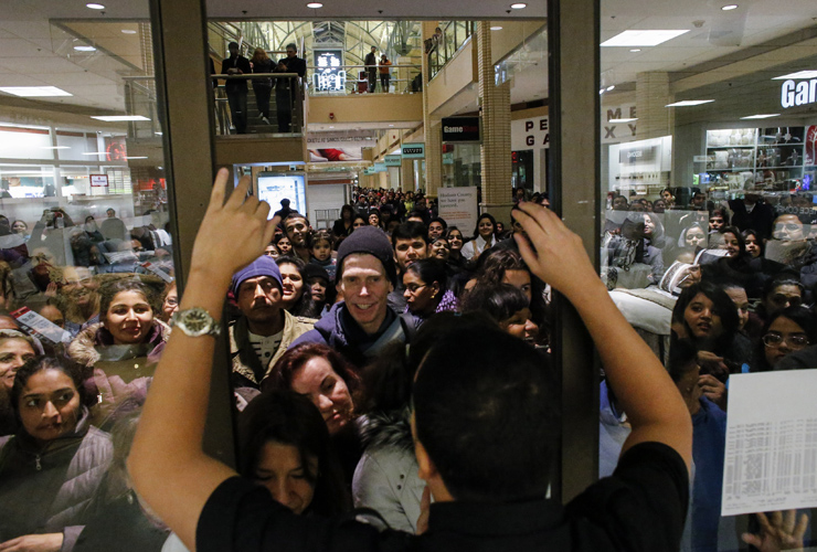 NEWPORT, NJ - NOVEMBER 27: People waits in line to go shopping at the to JCPenney store at the Newport Mall on November 27, 2014 in Jersey City, New Jersey. Black Friday sales, which now begi