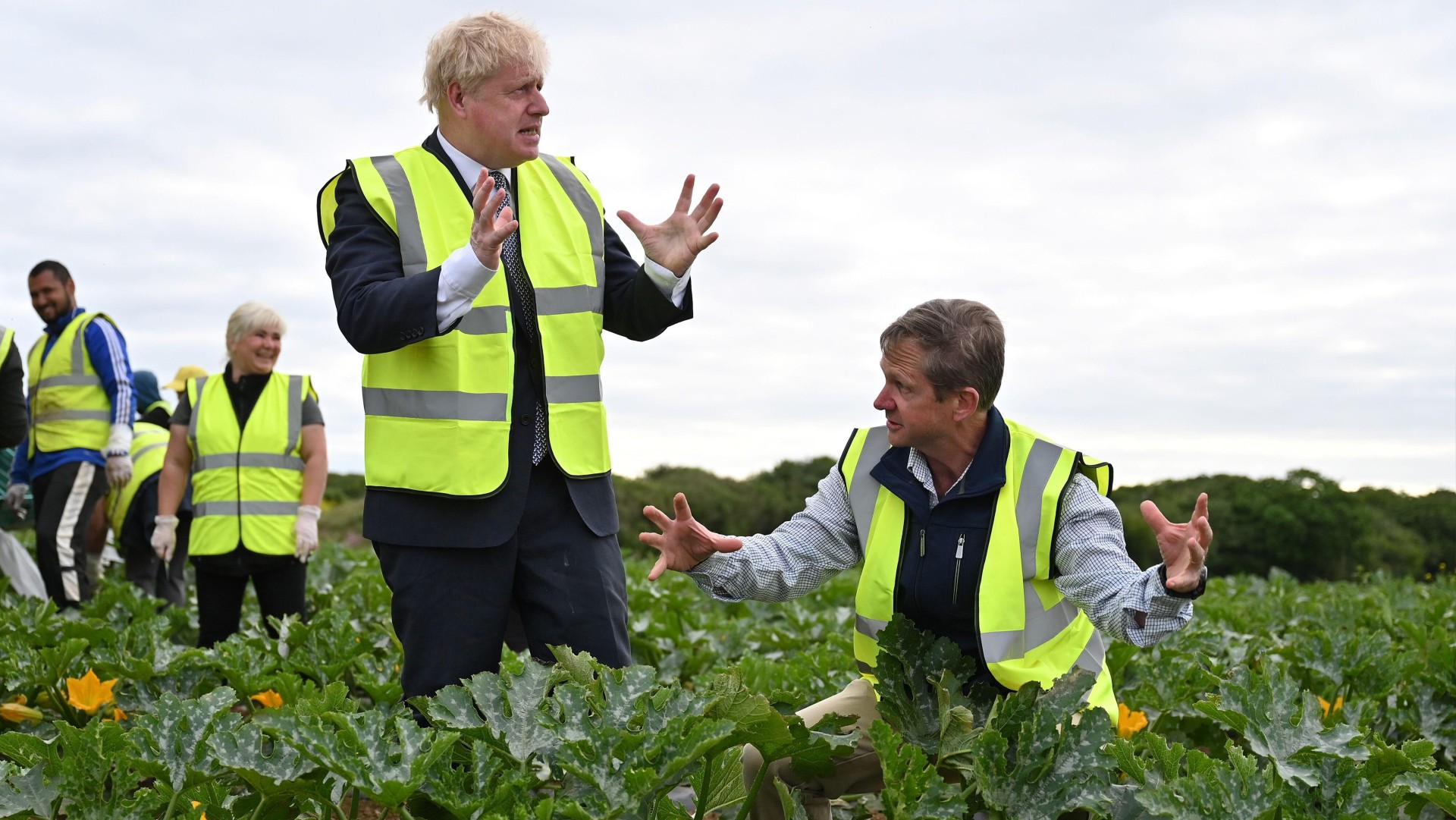 Boris Johnson talks to a farm manager in Hayle, Cornwall