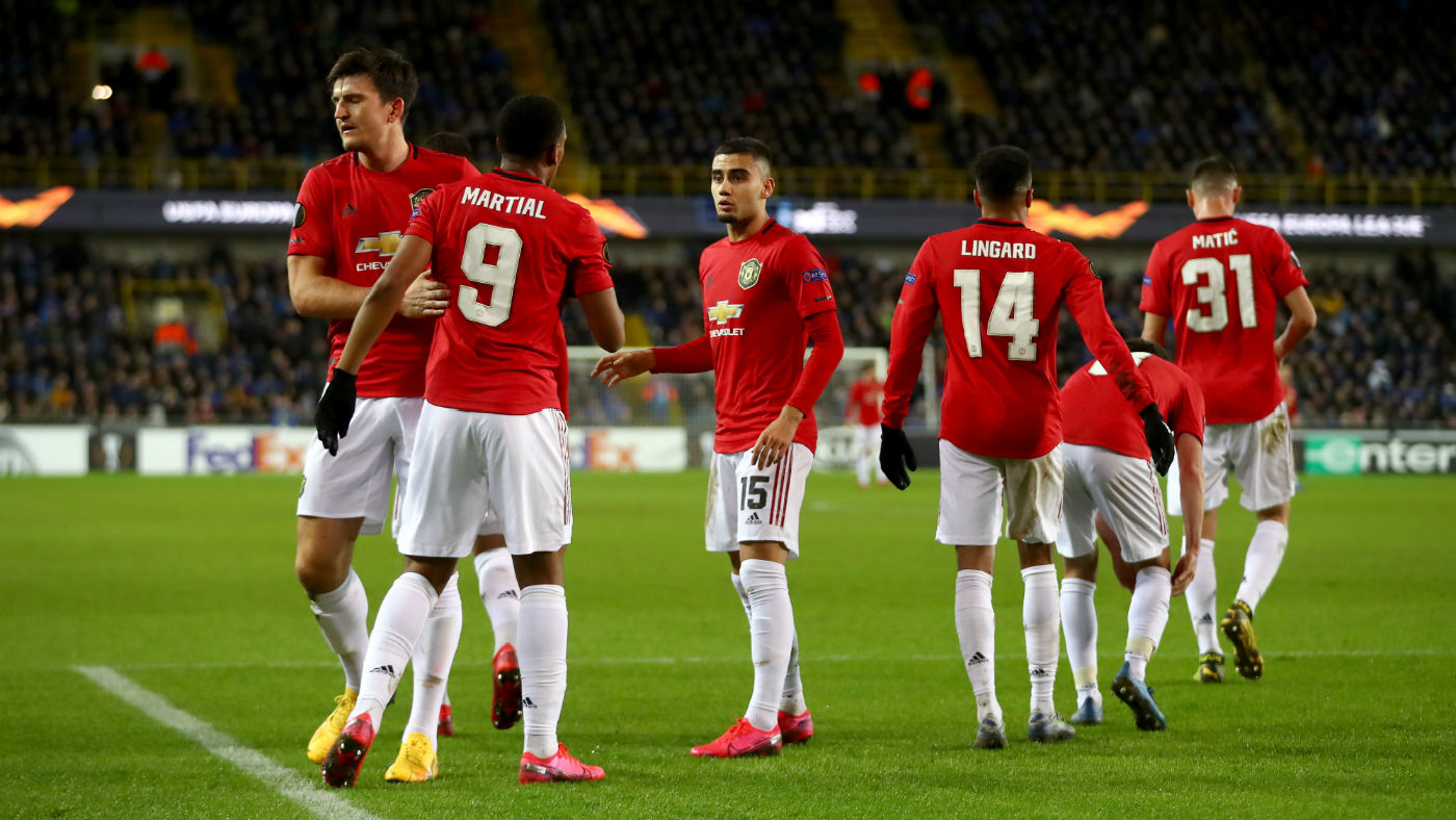 Manchester United players congratulate Anthony Martial on his goal against Club Bruges