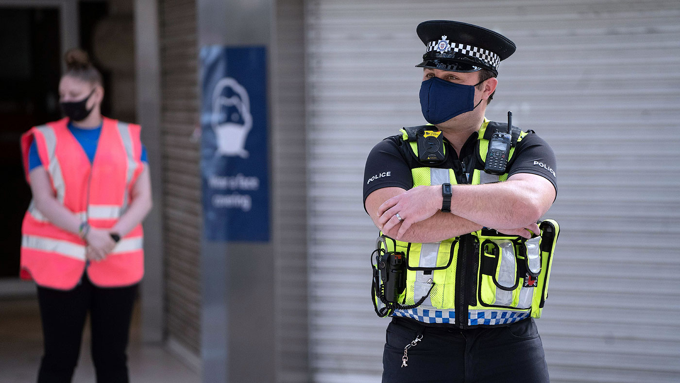 A police officer wearing a mask