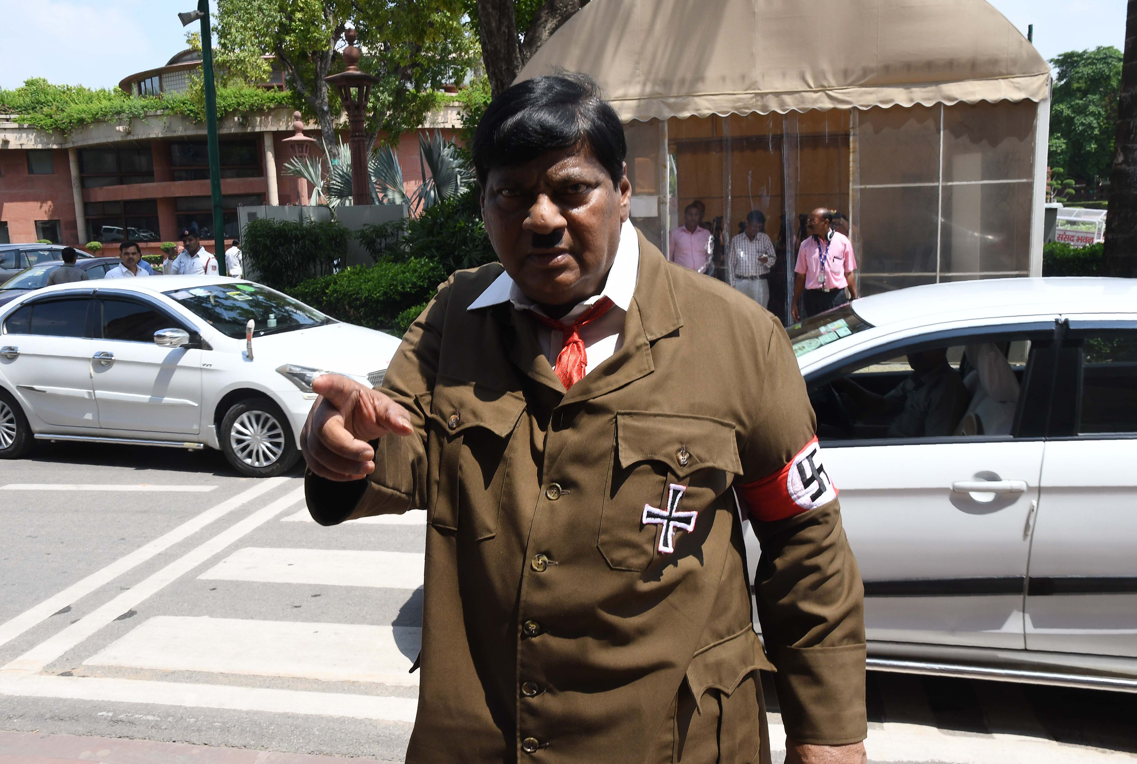 Indian film actor turned politician Naramalli Sivaprasad, arrives at parliament dressed as Adolf Hitler to press for government funding for his home state of Andhra Pradesh, in New Delhi on A