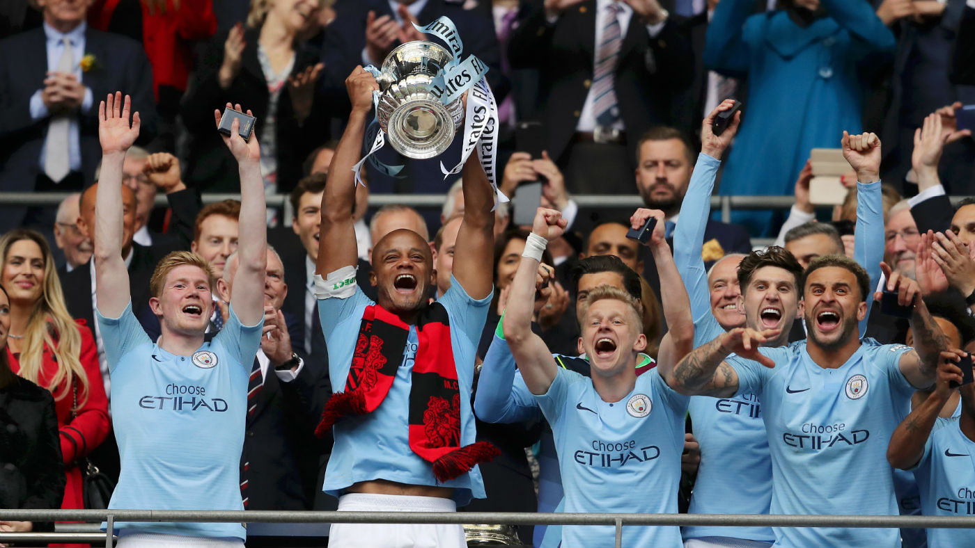 Man City captain Vincent Kompany lifts the FA Cup after the 6-0 win against Watford in the final