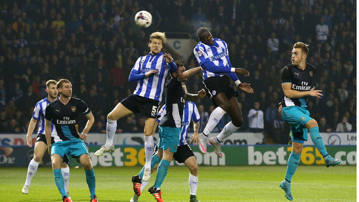 Lucas Joao of Sheffield Wednesday rises above the Arsenal defence