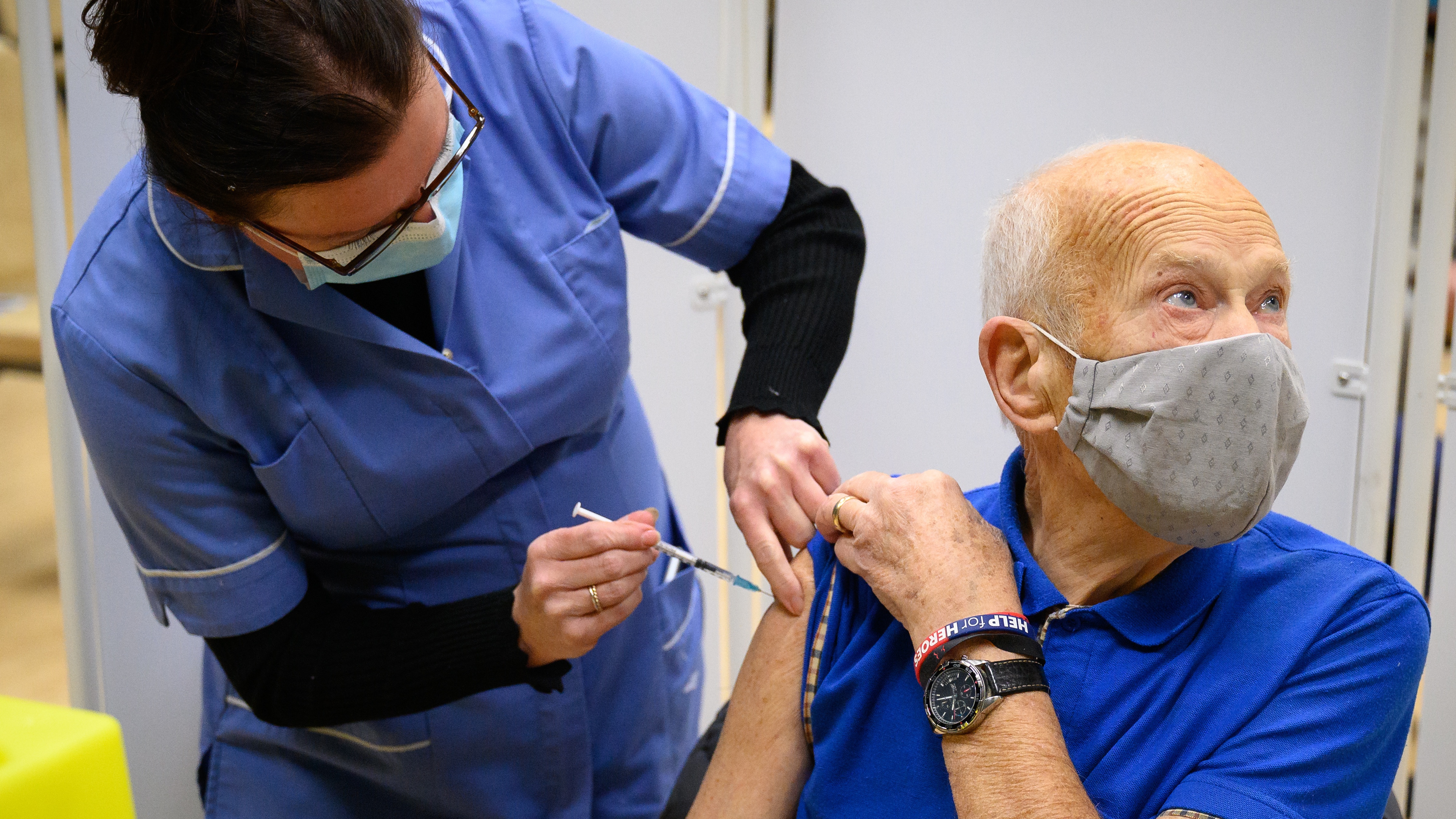 An elderly man receives his Covid vaccination in Surrey.