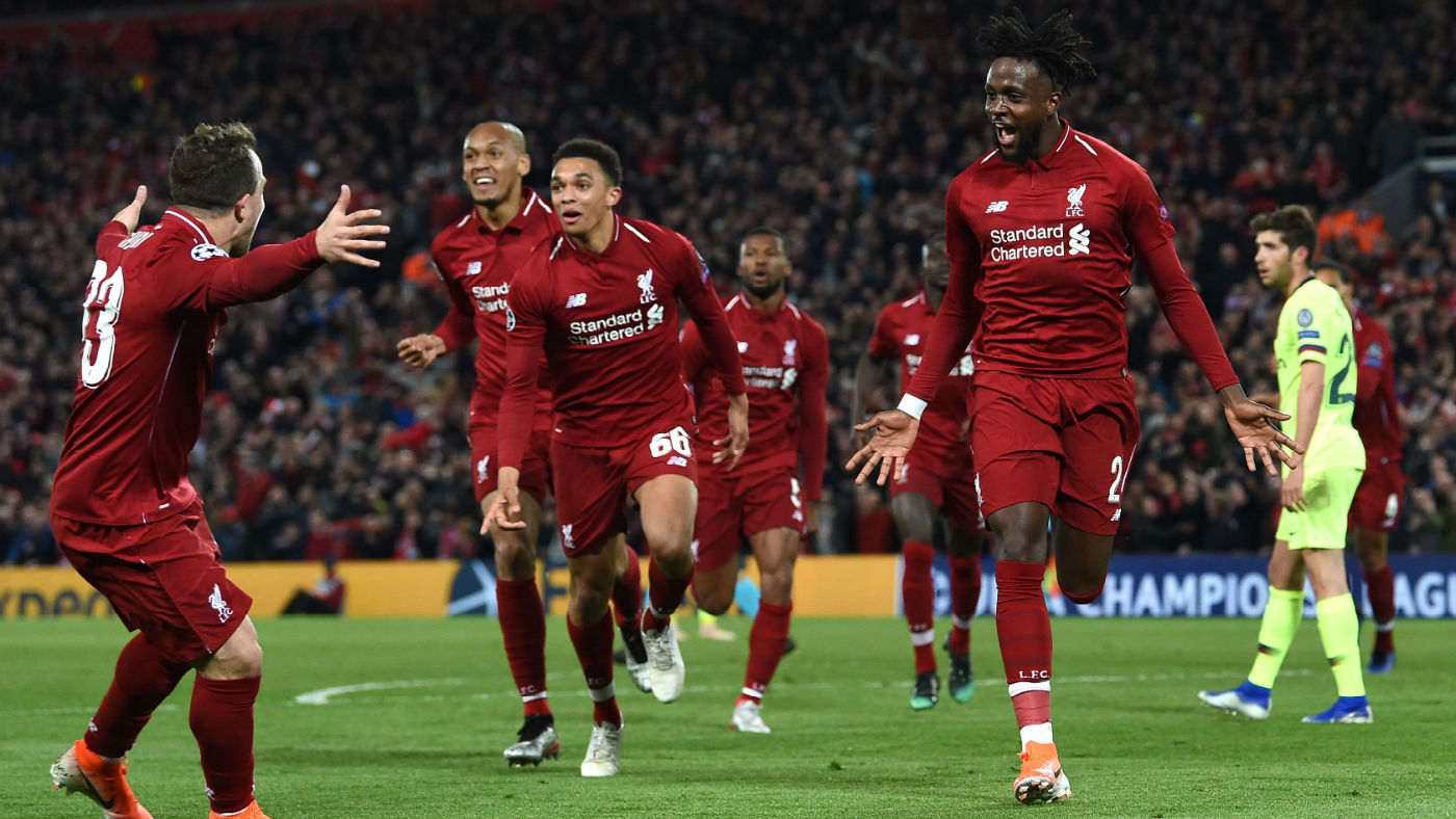 Liverpool’s Divock Origi (right) celebrates scoring the fourth goal against Barcelona at Anfield