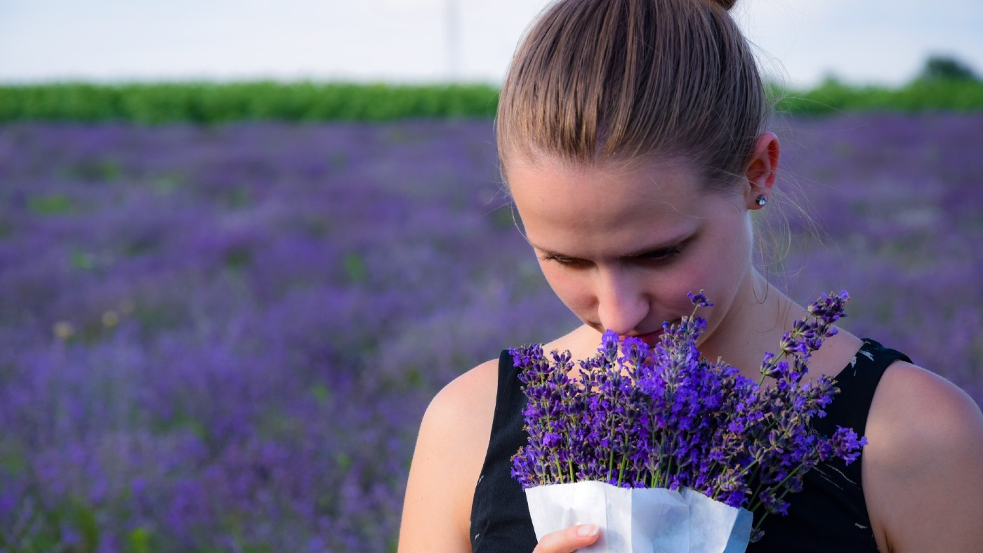 Woman smelling lavender 