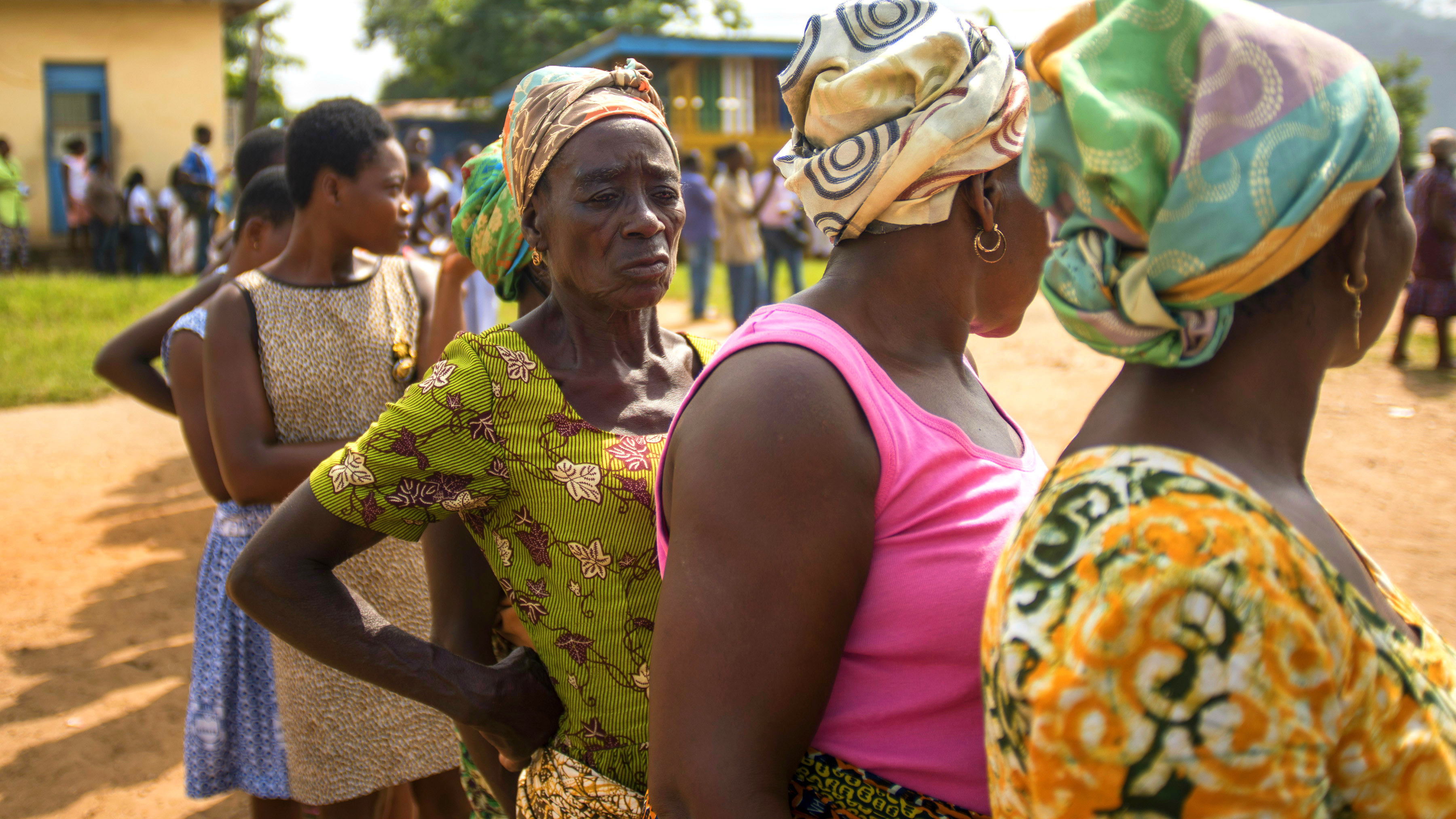 Women queue to vote outside a polling station in Ghana