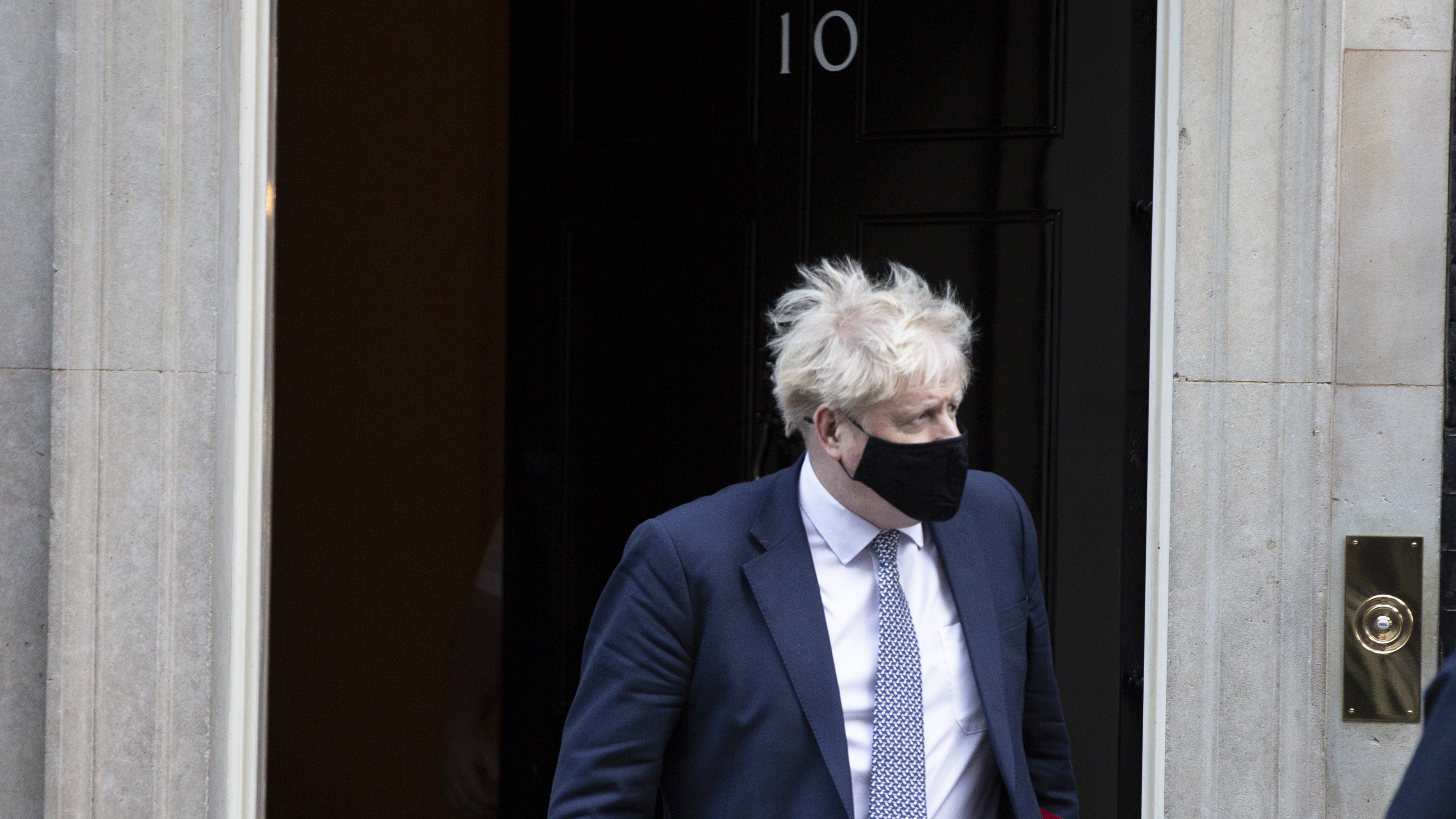 Boris Johnson leaves No. 10 Downing Street to attend PMQs