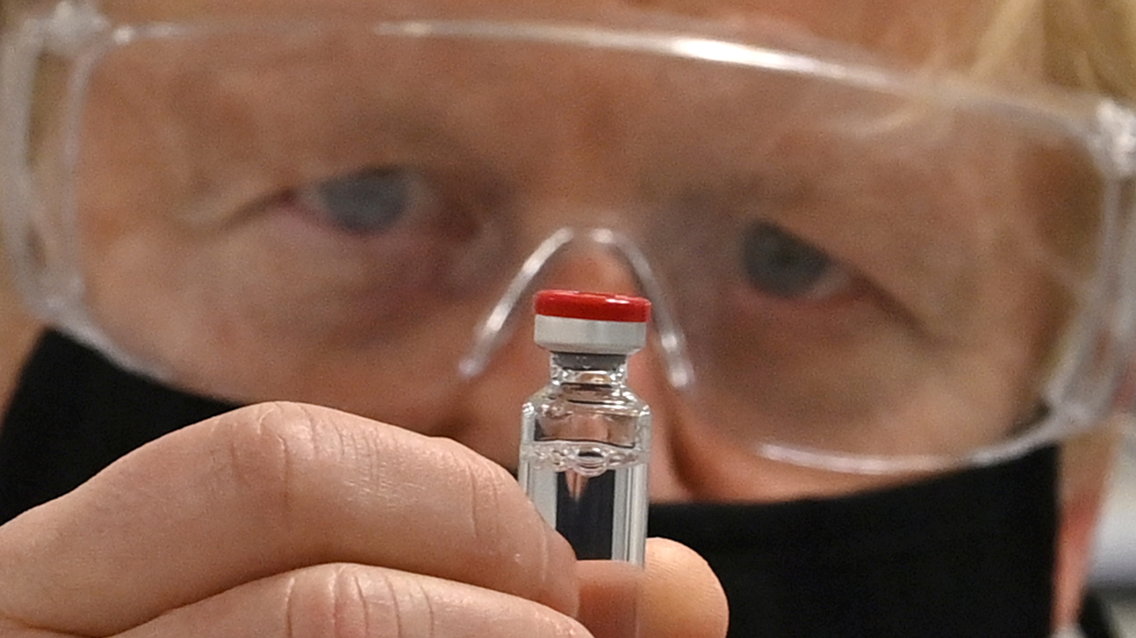 Boris Johnson with a vial of the AstraZeneca/Oxford University vaccine