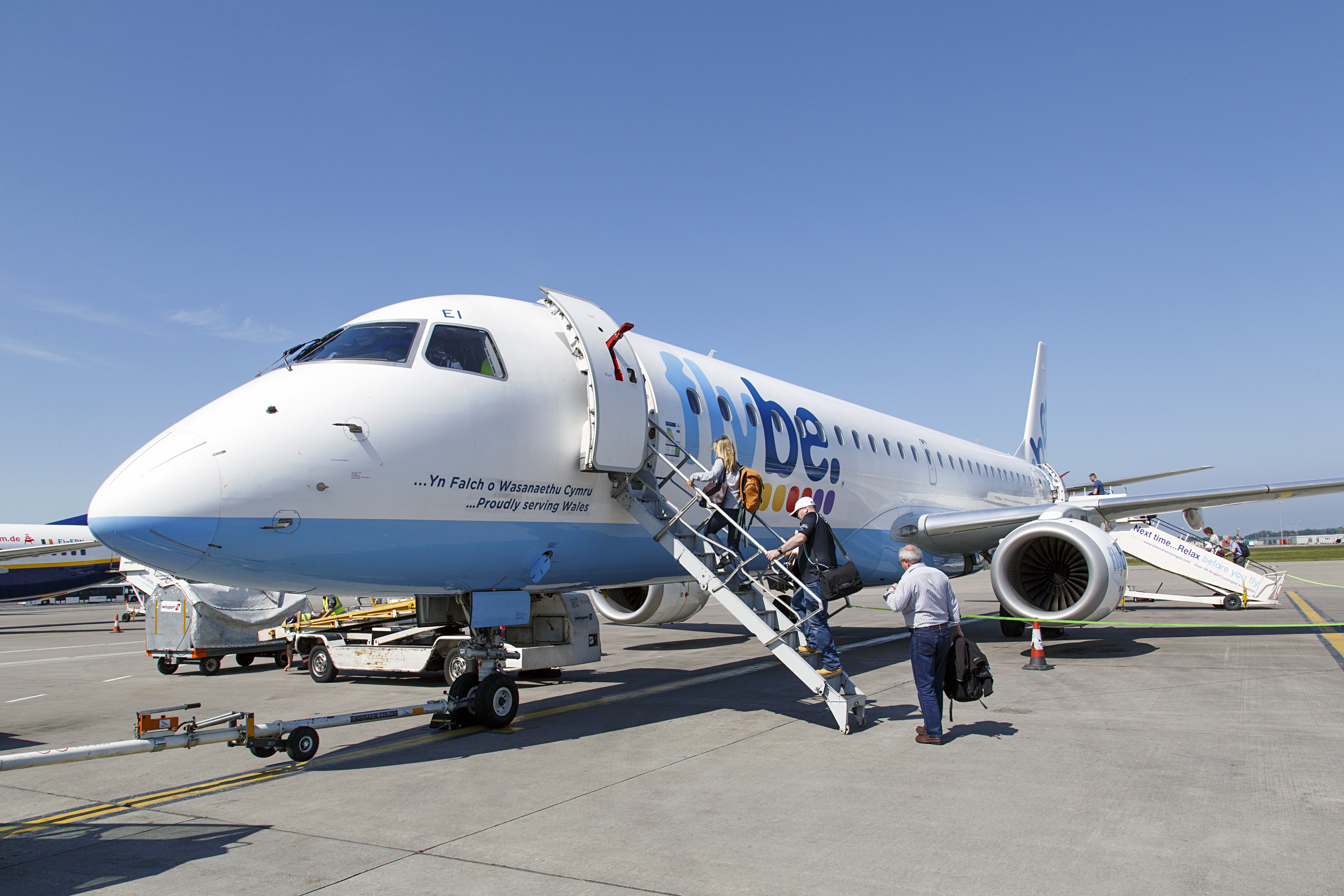 Edinburgh, UK: May 29, 2016: Passengers board a scheduled flight from Edinburgh to Cardiff. Flybe is the largest independent regional airline in Europe and is based in Exeter.