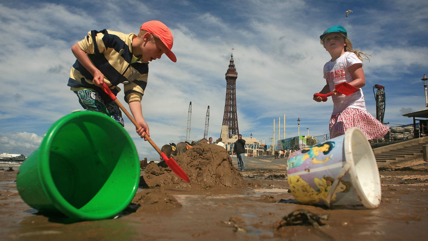 Two children play on Blackpool beach