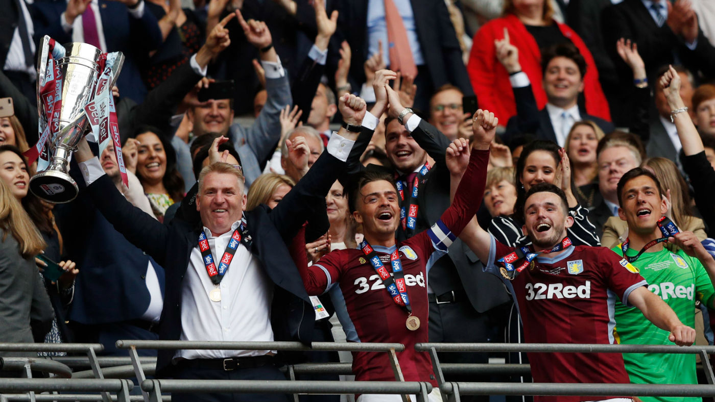 Aston Villa head coach Dean Smith and captain Jack Grealish celebrate the play-off final win