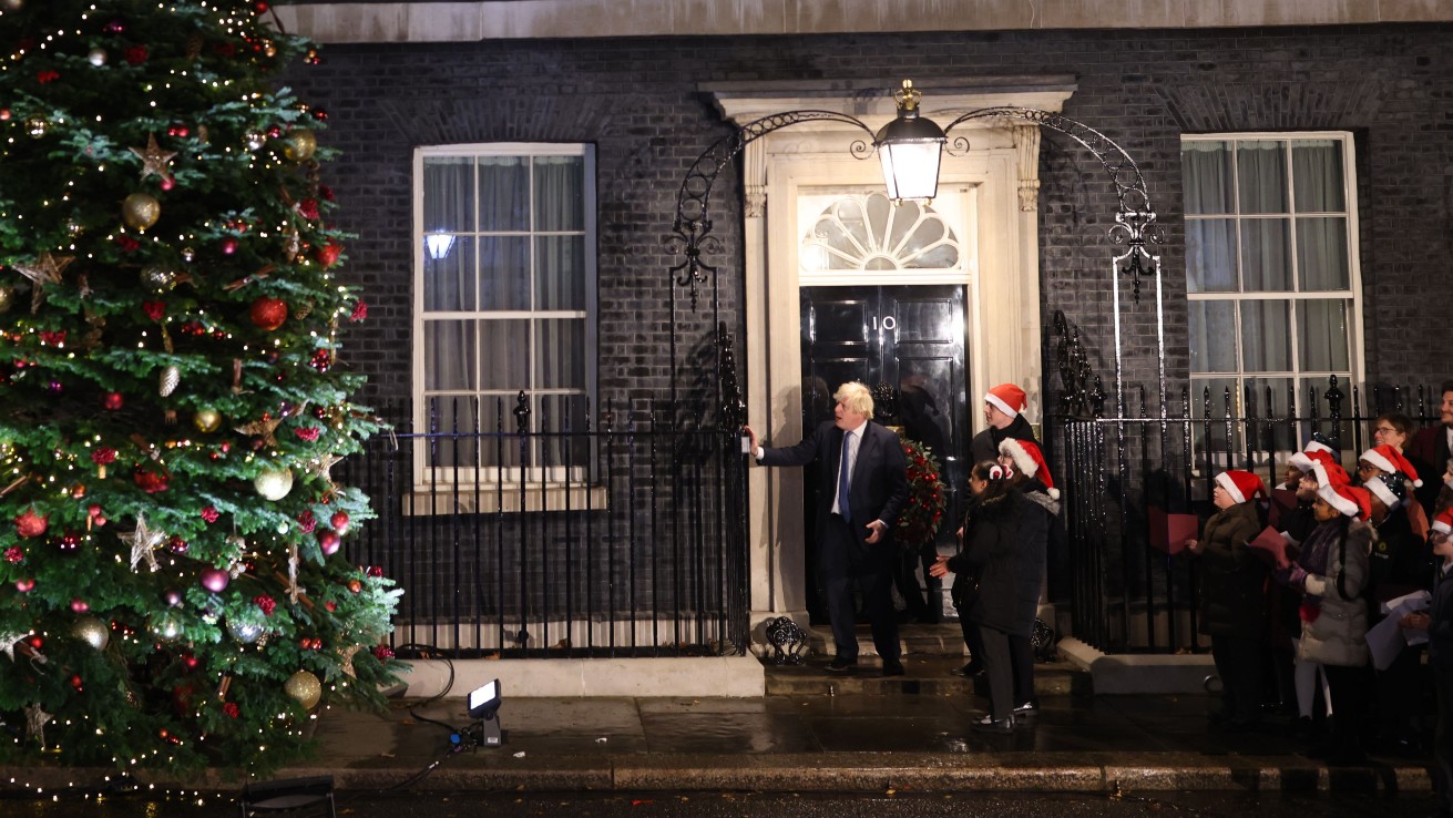 Boris Johnson turns on the Christmas tree lights at Downing Street