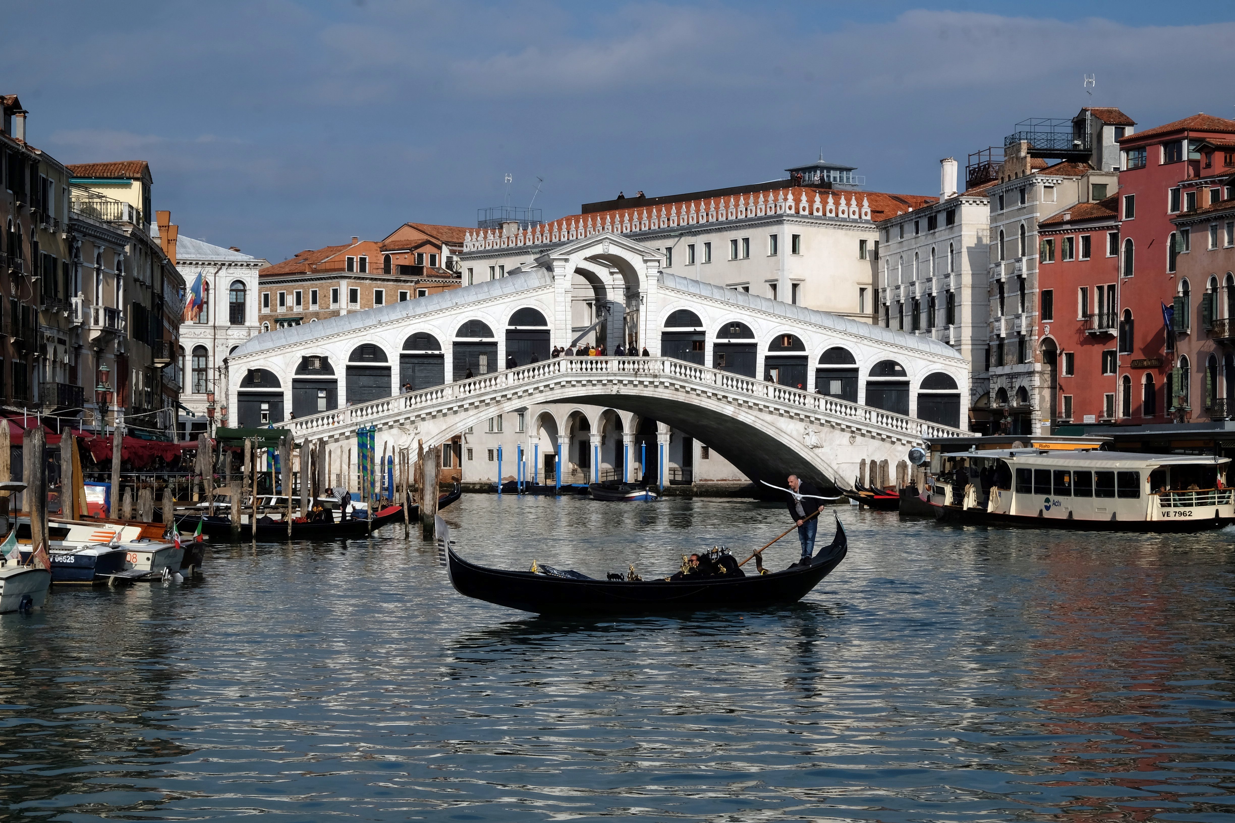 A gondola on an empty Grand Canal in Venice