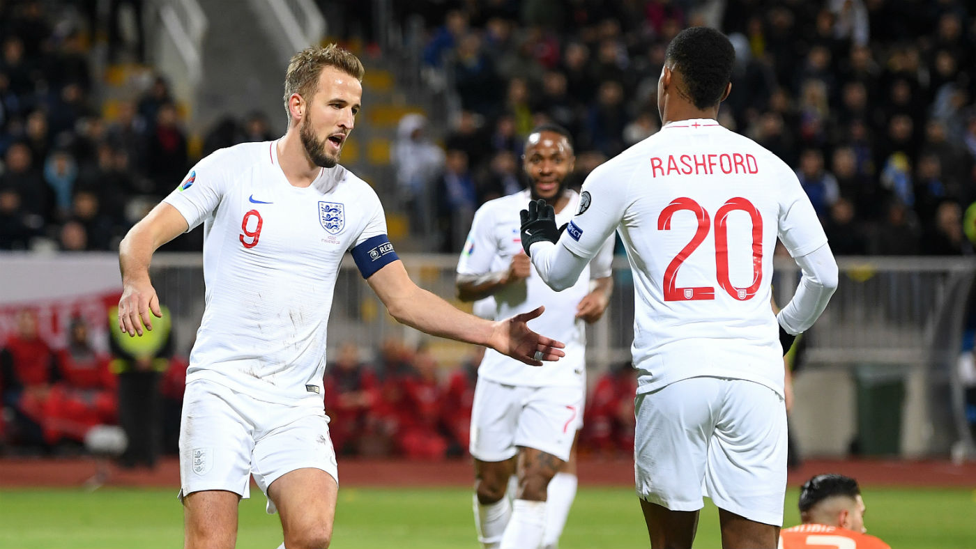 England captain Harry Kane celebrates a goal with fellow striker Marcus Rashford  