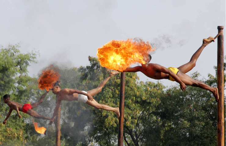 Indian soldiers take part in a fire-breathing demonstration