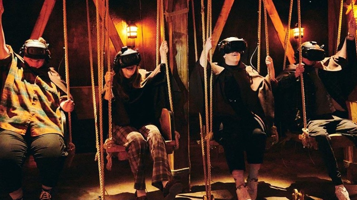 Audience members with VR headsets