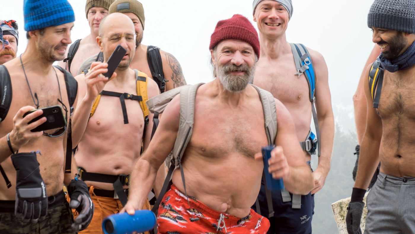 Wim Hof stands in crowd of swimmers