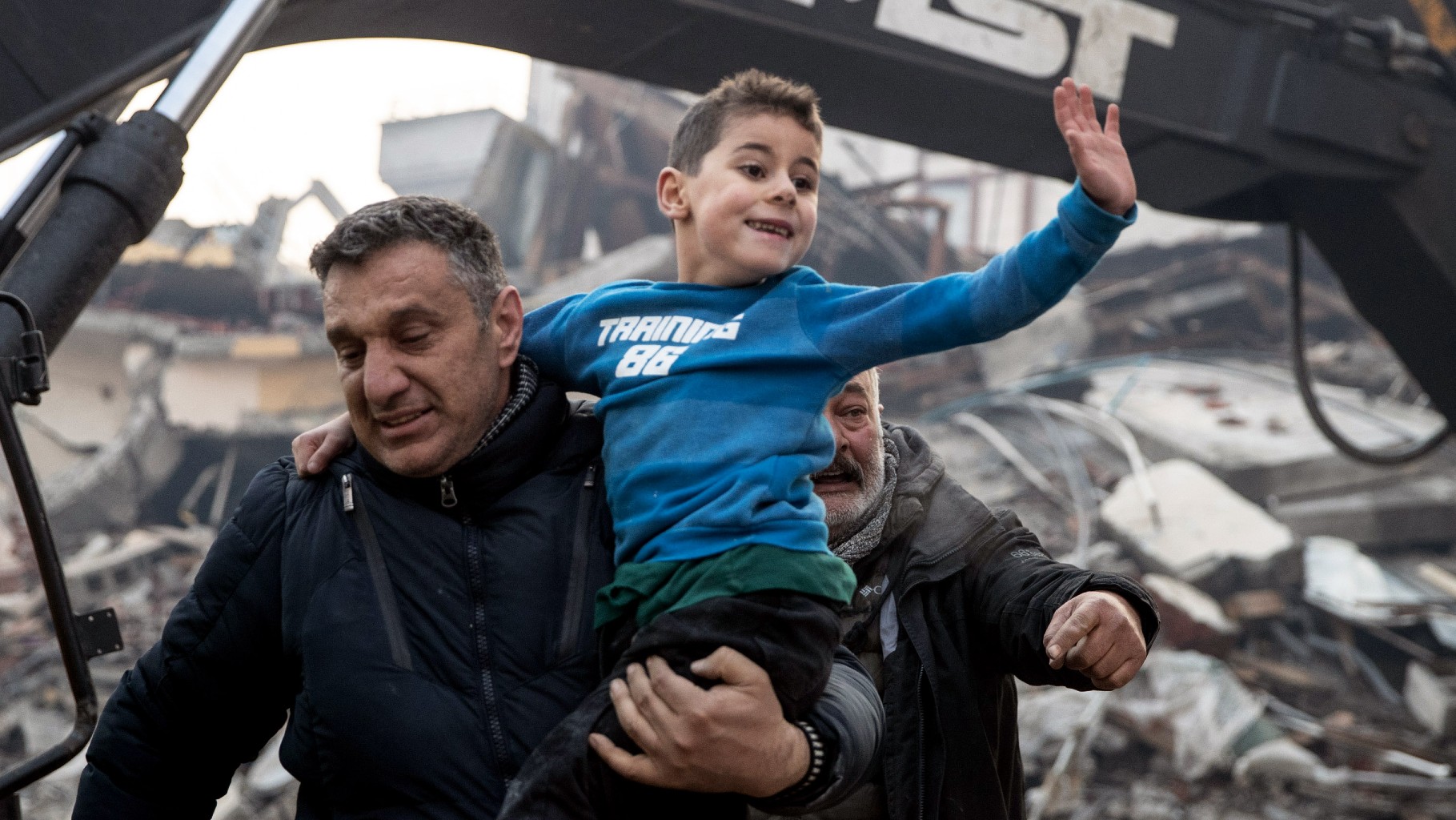 An eight-year-old boy is rescued from a collapsed building in Hatay