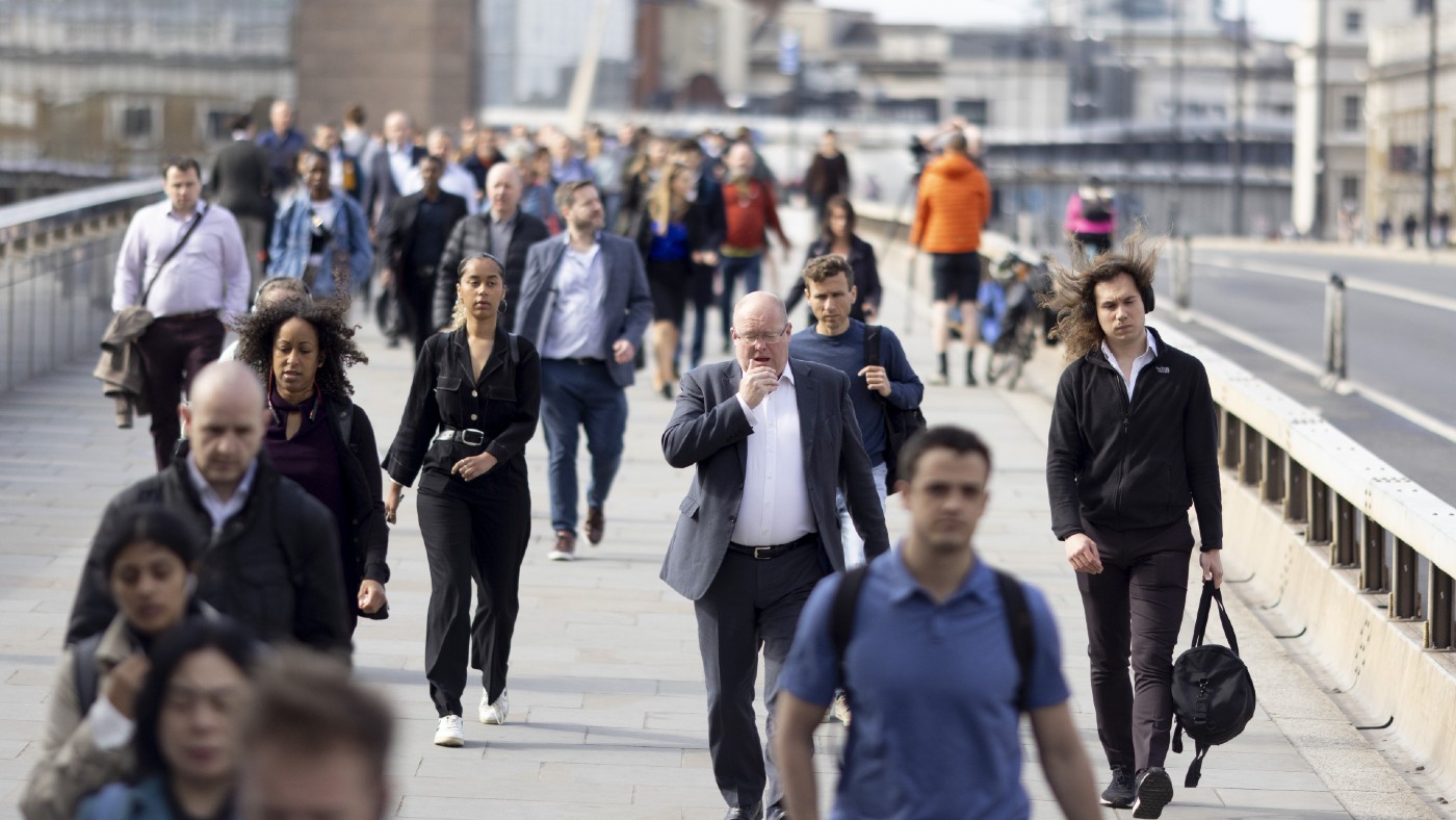 Morning commuters on London Bridge in May 2022