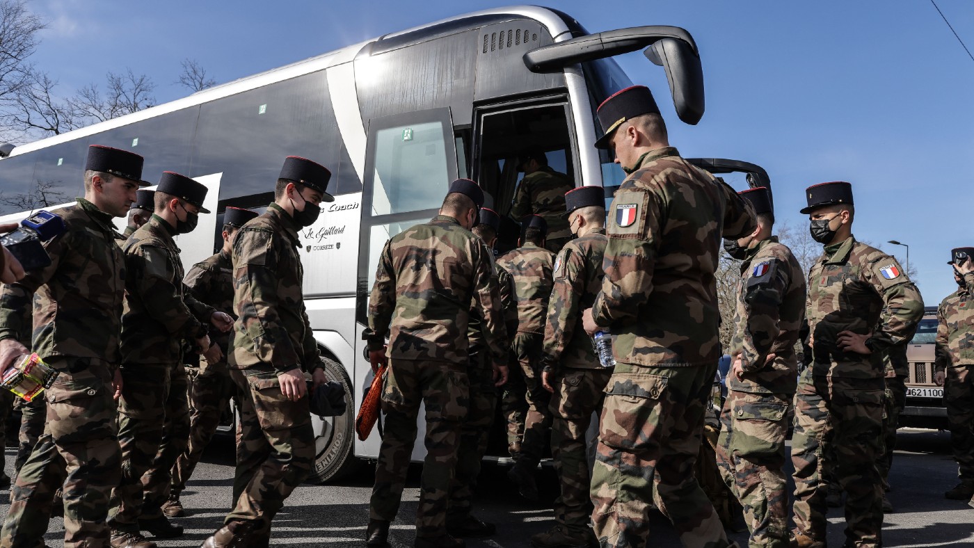 French soldiers board a bus