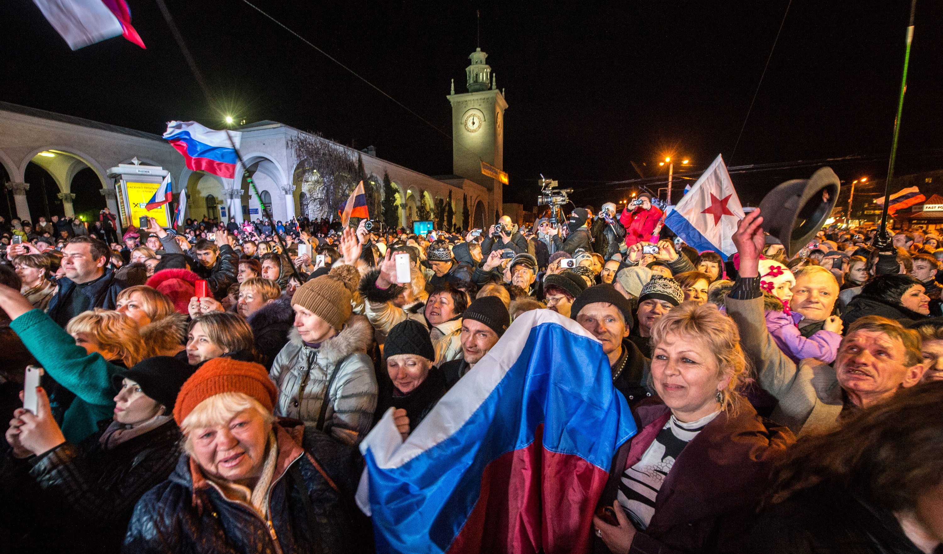People celebrating in a square in Crimea