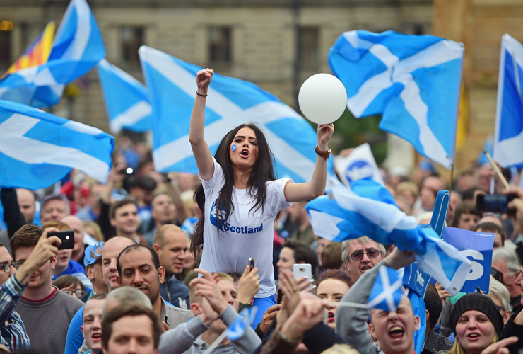 GLASGOW, SCOTLAND - SEPTEMBER 17:A young women joins Yes activists as they gather in George Square on September 17, 2014 in Glasgow,Scotland.The referendum debate has entered its final day of
