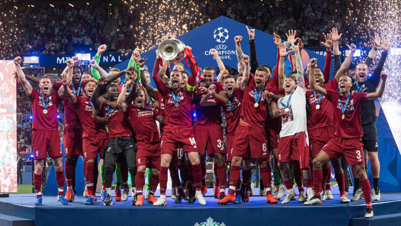 Liverpool captain Jordan Henderson lifts the Champions League trophy in Madrid