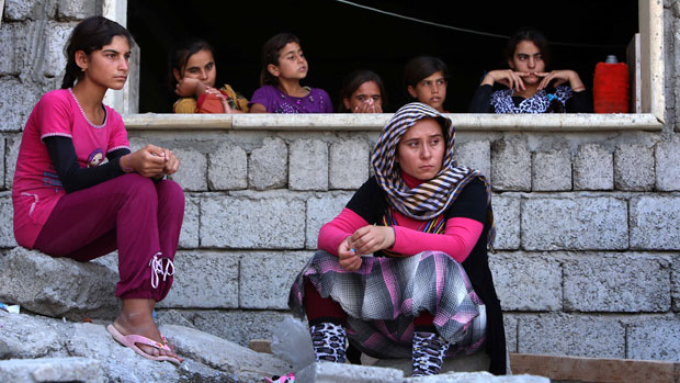 Yazidi women take shelter at a school in the Kurdish city of Dohuk