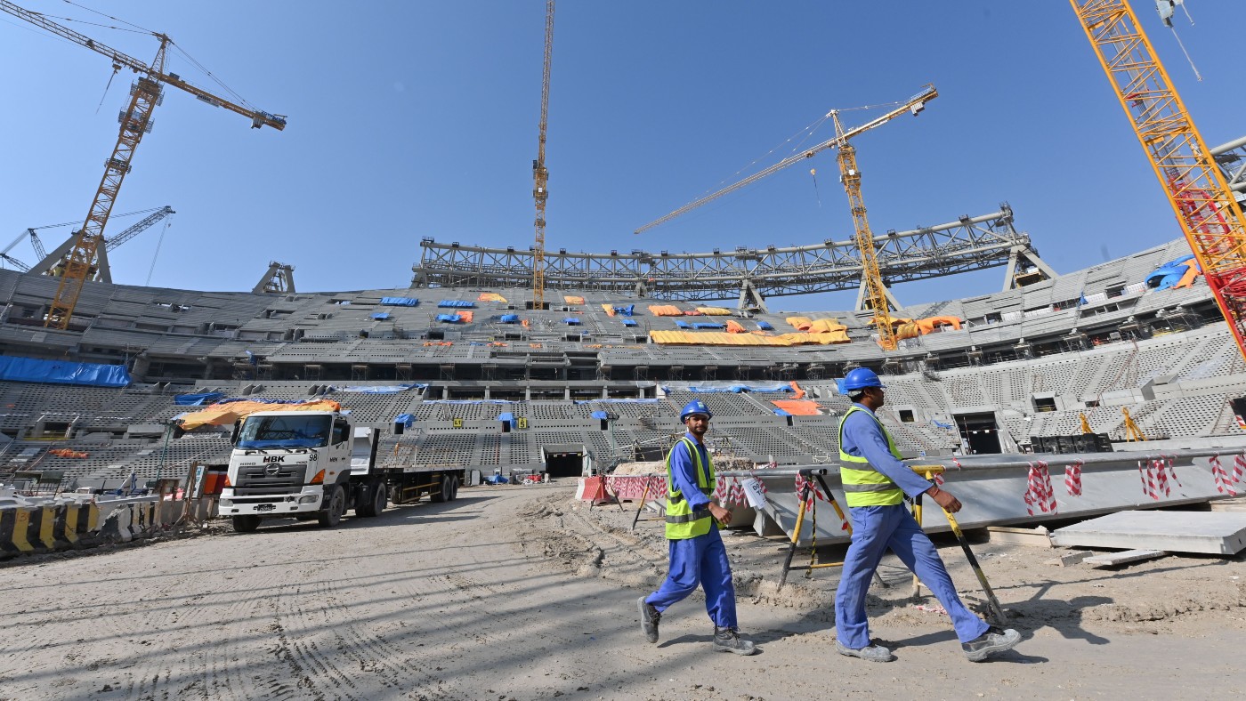 Workers at the site of the Lusail Stadium in 2019  