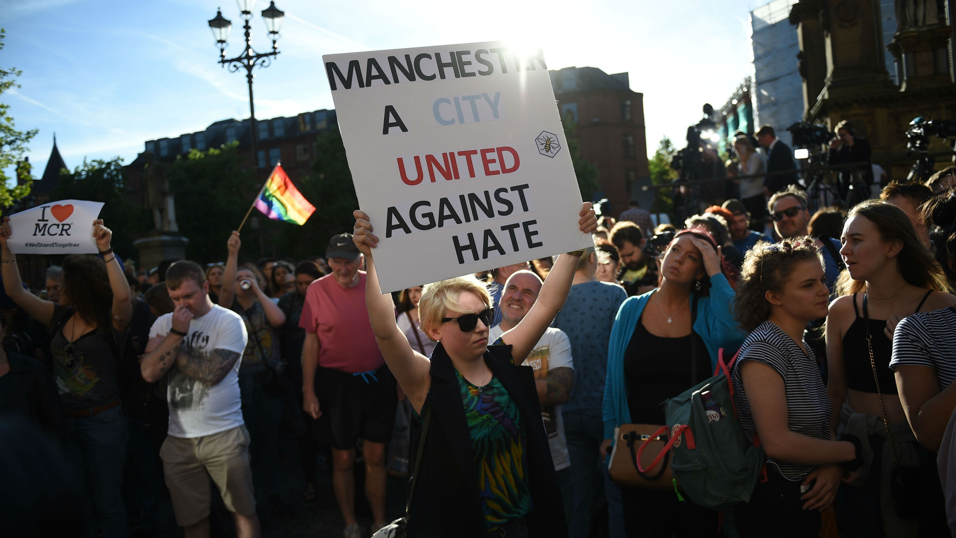 Woman holds sign up at Manchester terror attack vigil 