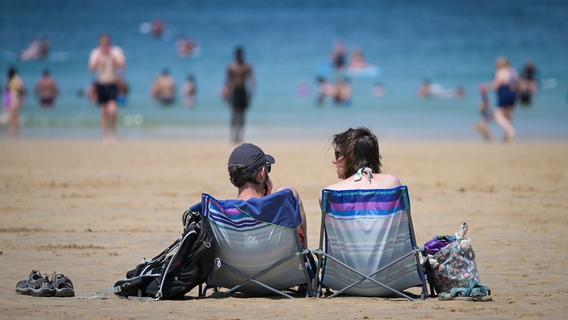 Visitors enjoy the hot weather in Harlyn Bay, Cornwall