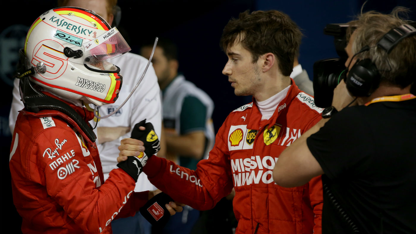 Sebastian Vettel consoles his Ferrari team-mate Charles Leclerc at the F1 Bahrain Grand Prix