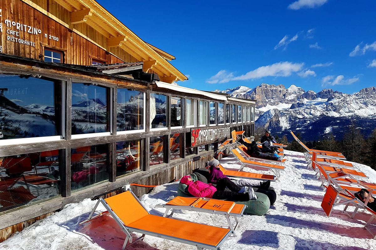 Deck chairs on the snow outside Club Moritzino