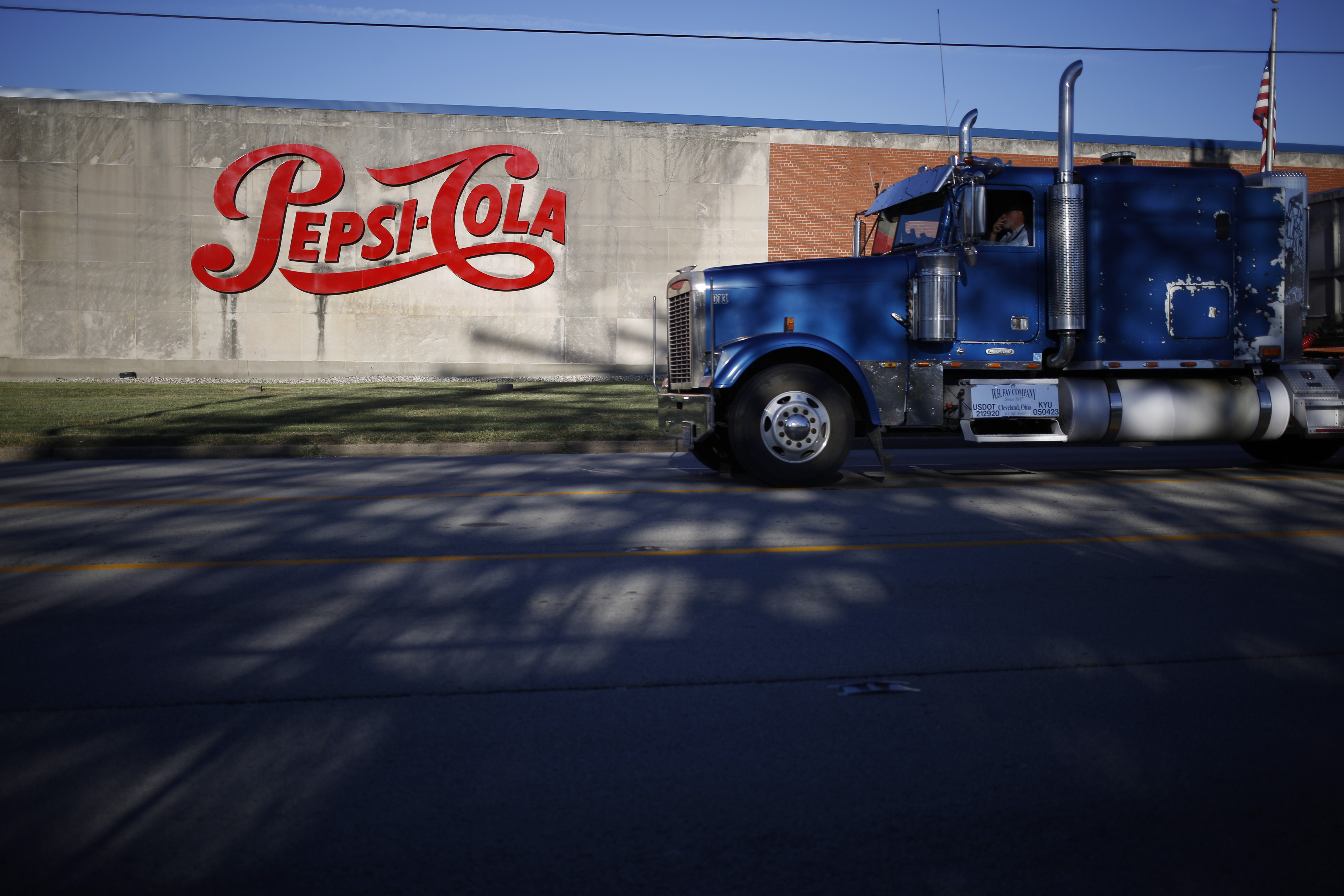 A truck passes in front of a PepsiCo Inc. facility in Louisville, Kentucky, U.S., on Tuesday, Sept. 24, 2019. PepsiCo Inc. is scheduled to release earnings figures on October 3. Photographer:
