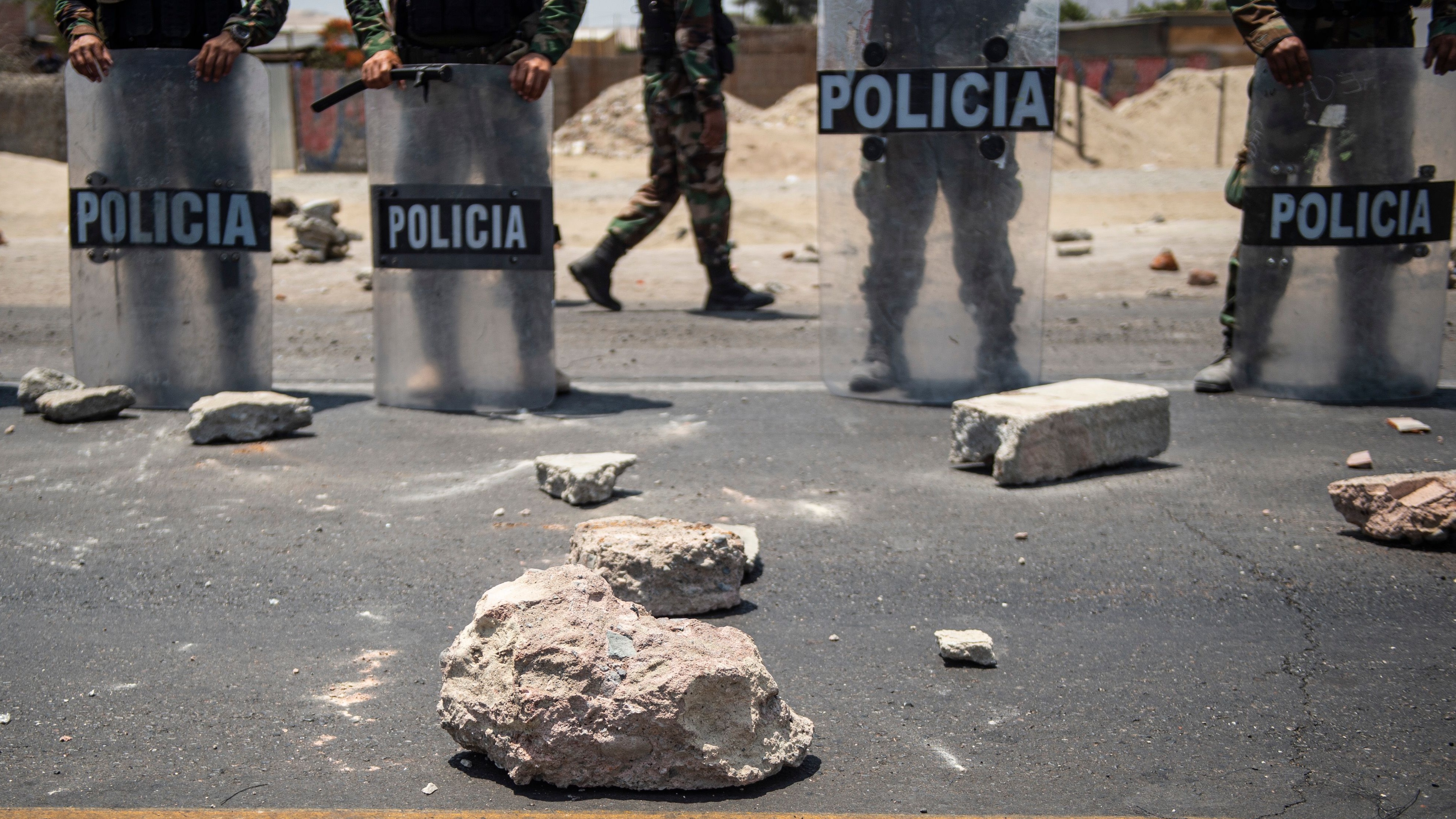 Rocks thrown at police during a peasants protest demanding a higher salary in Ica, Peru.