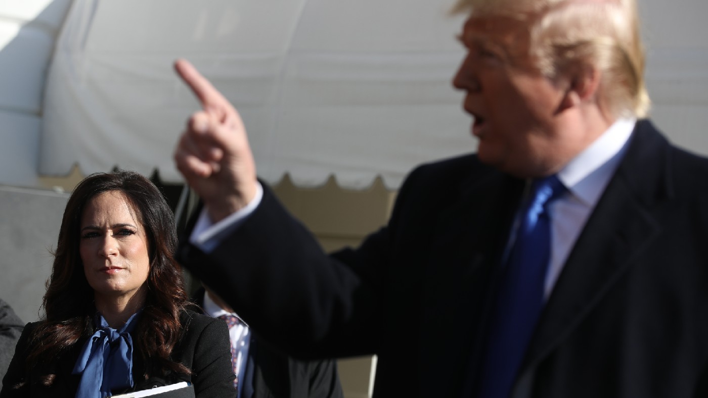 Stephanie Grisham pictured with Donald Trump in 2019