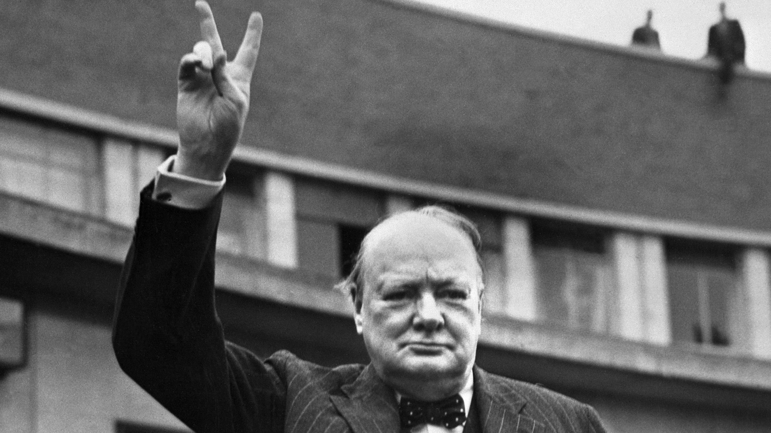 Sir Winston Churchill making the victory sign.