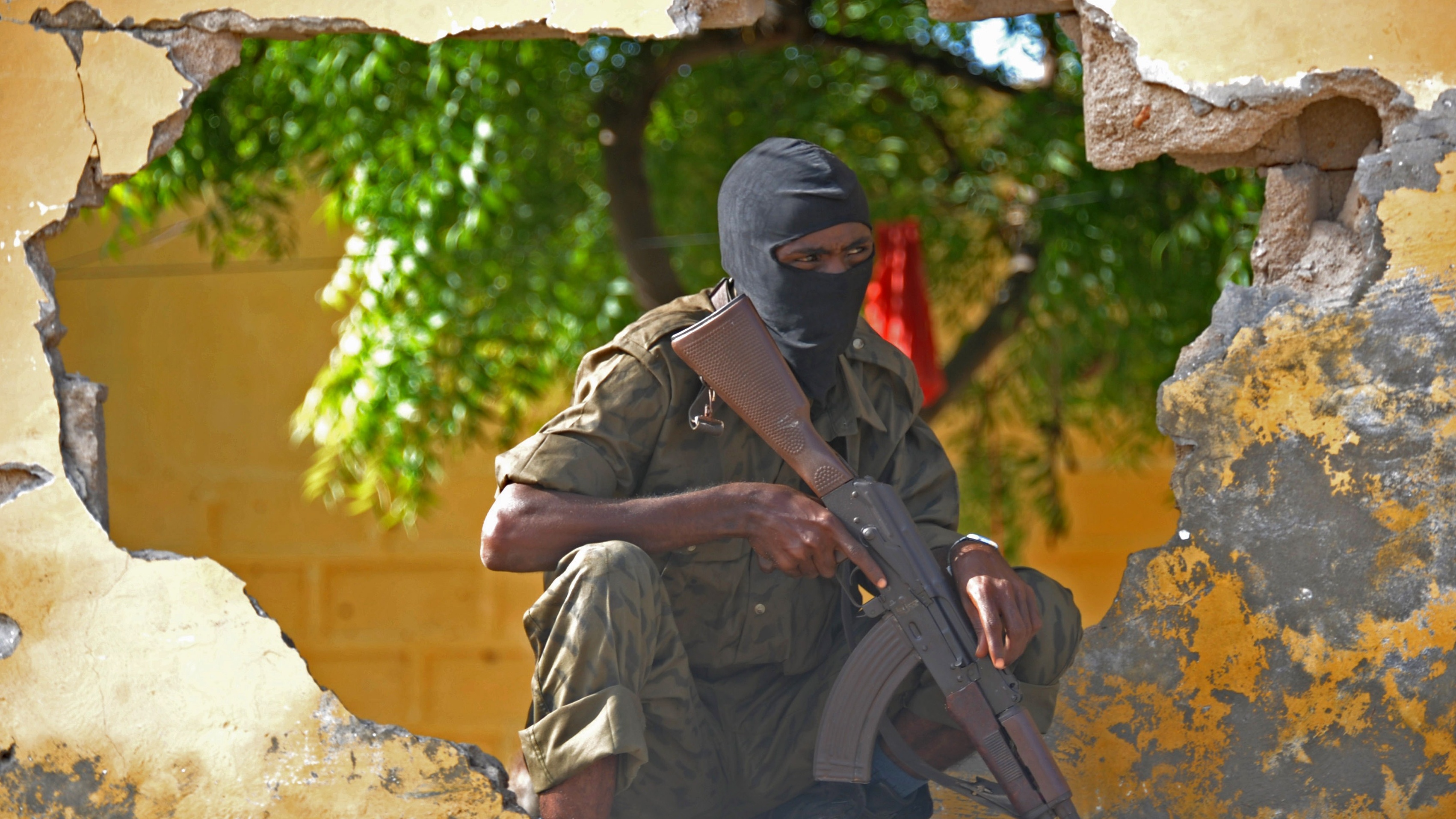 A Somali soldier stands guard after an al-Shabaab attack in 2015
