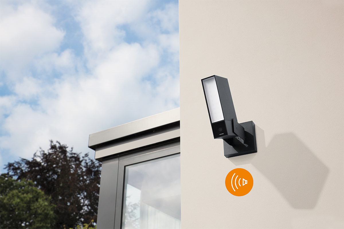 Netatmo Smart Alarm System mounted on exterior wall of house