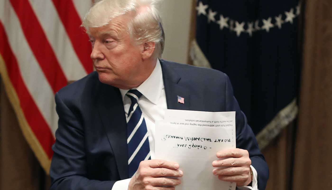 Donald Trump reads from a heavily amended script to clarify Russian meddling claims
