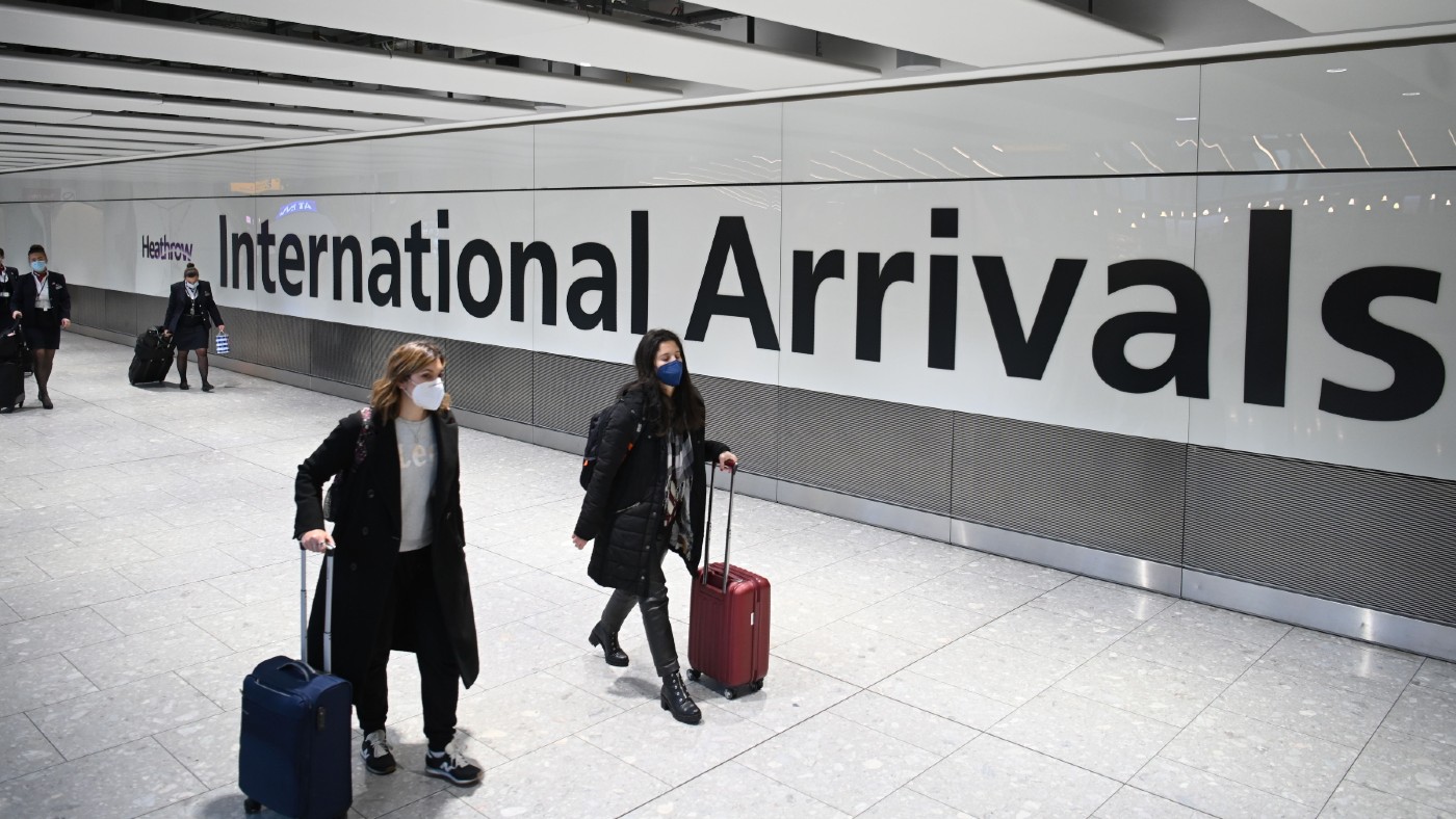 Airline passengers arrive at Heathrow Airport in London  
