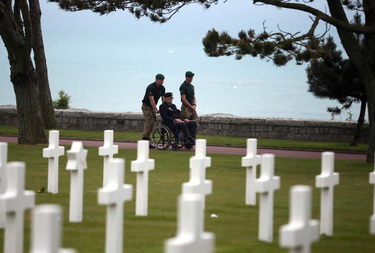 A British veteran of D-Day visits a military cemetery in Normandy
